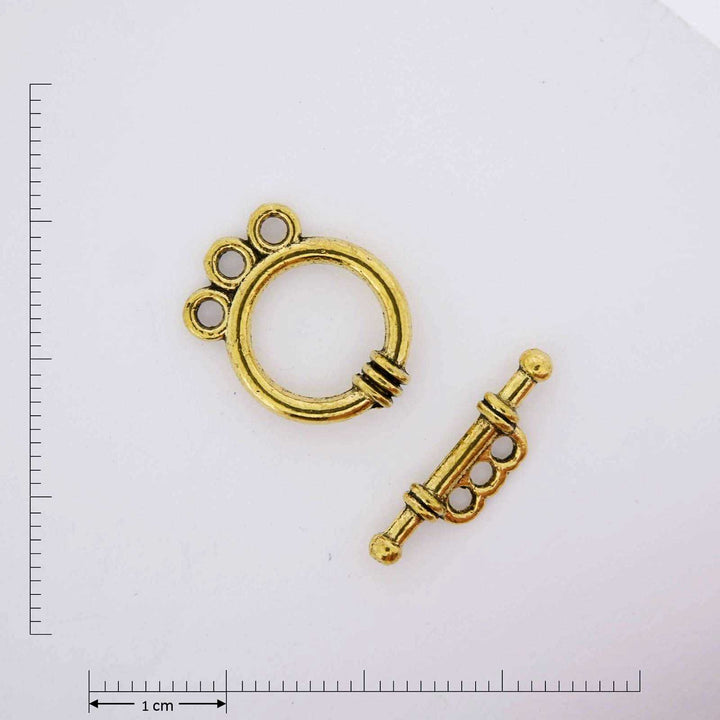Gold triple ring toggle.