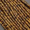 Bundle of tiger’s eye heishi bead strands showing varied golden brown striping and texture.