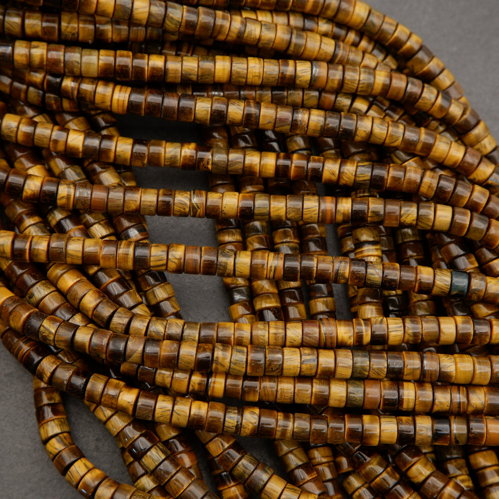 Natural tiger’s eye heishi beads with smooth polished finish and rich earth-tone coloration.