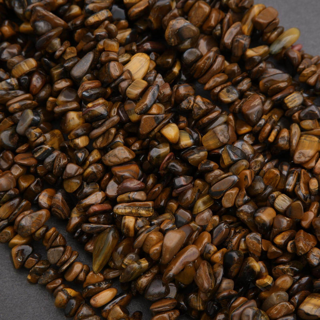 Close-up of brown and black pebbles on a dark surface