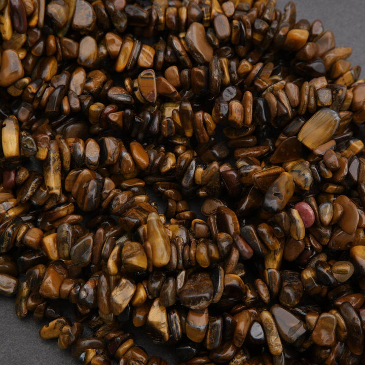 Close-up of a pile of brown and black stones on a dark background