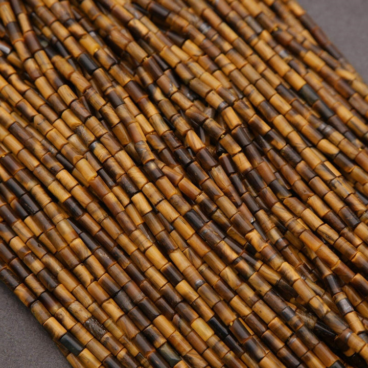 Close-up of brown and black beaded string on a gray background