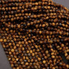 Close-up of brown faceted beads on a gray background