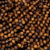 Close-up of brown beads with a faceted texture