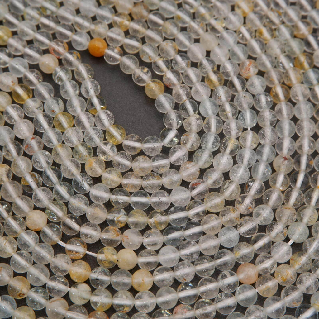 Close-up of a string of clear and multicolored beads.