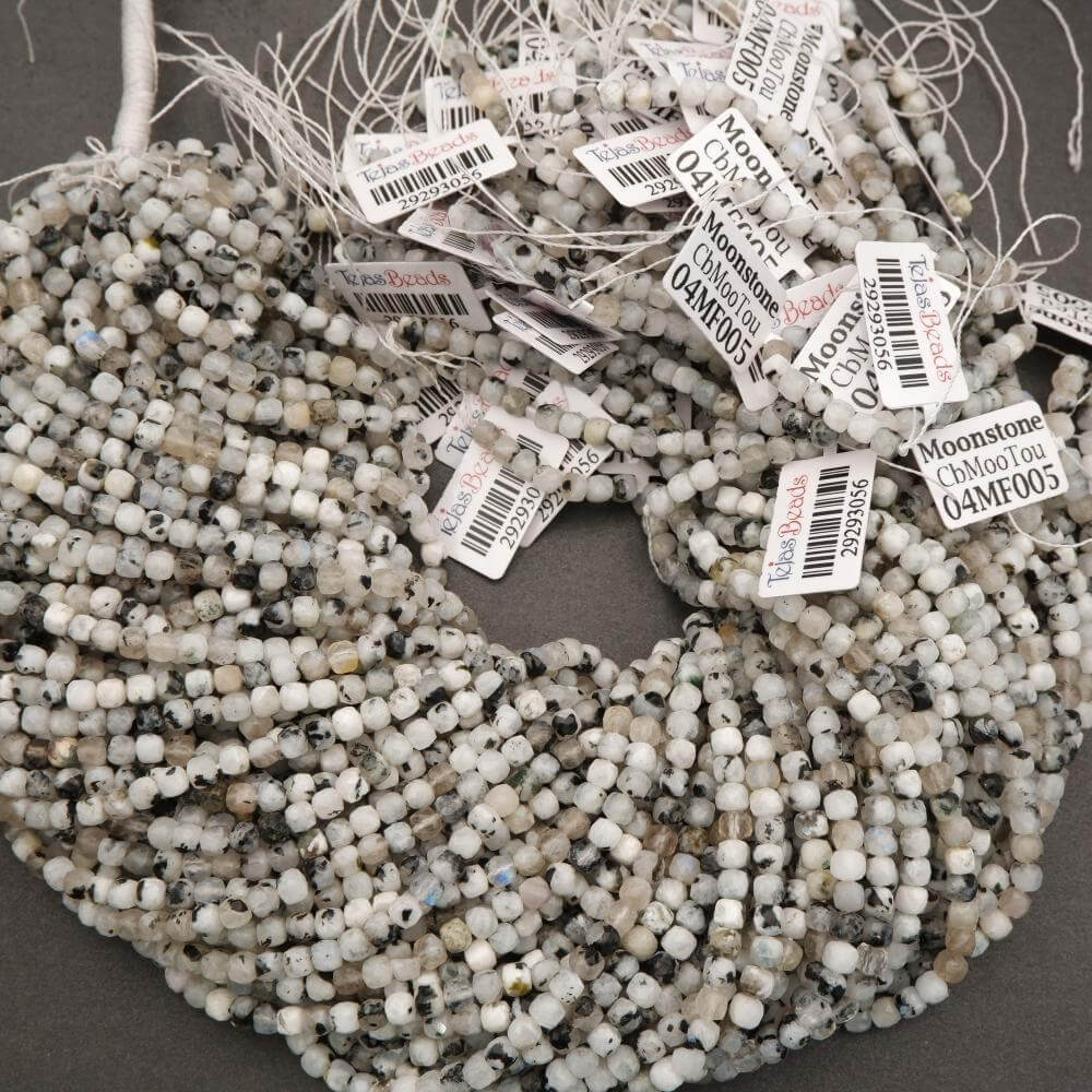String of beads with labels on a dark background