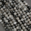 Natural tourmalated quartz gemstone beads showing black needle inclusions