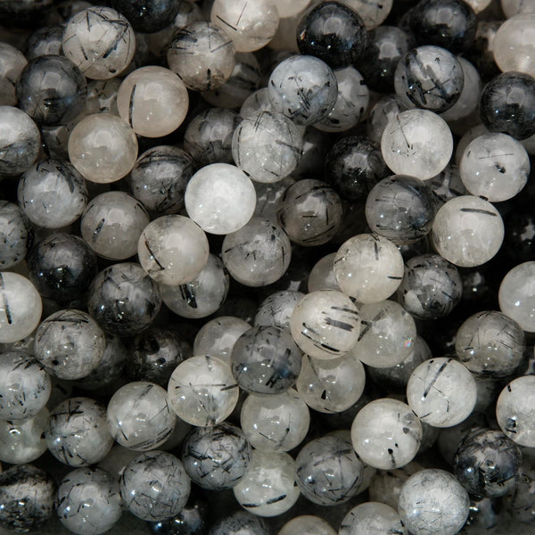 Tourmalated quartz beads with black tourmaline inclusions and translucent white quartz