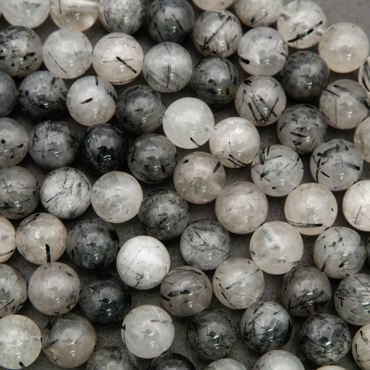 Tourmalated quartz gemstone beads with natural internal tourmaline patterns