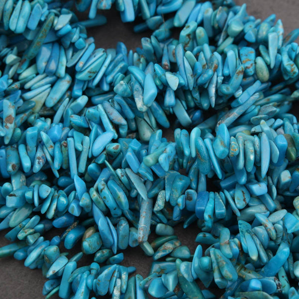 Close-up of blue turquoise beads on a dark background