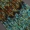 Close-up of multicolored beads on a gray surface