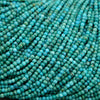 Tiny natural turquoise gemstone beads in strands with blue-green tones and matrix patterns