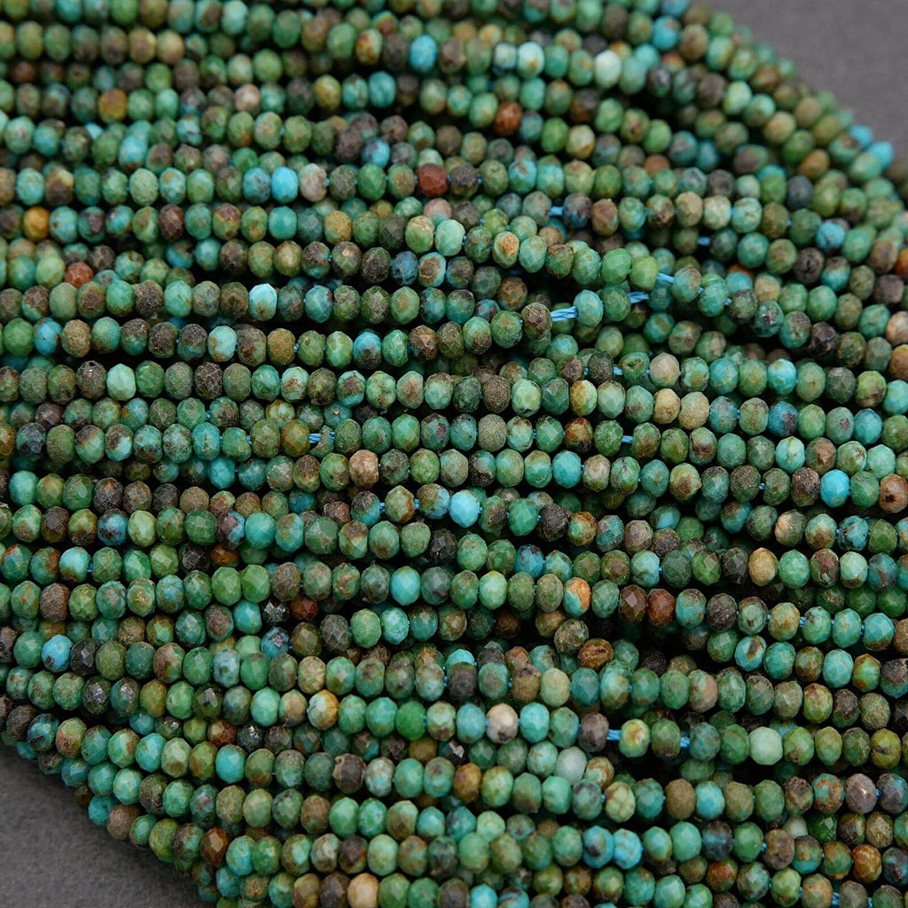 Close-up of a string of green and brown beads on a gray surface