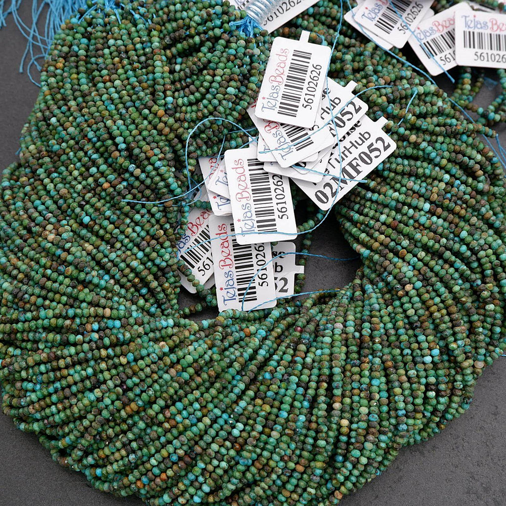 String of green beads with price tags on a gray surface