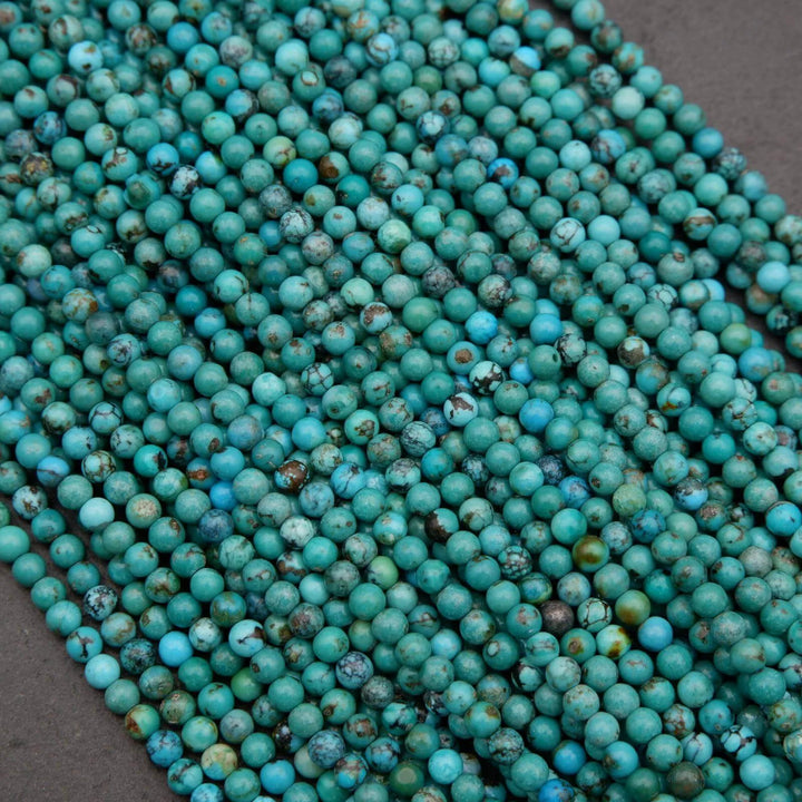 Close-up of turquoise beads on a dark surface