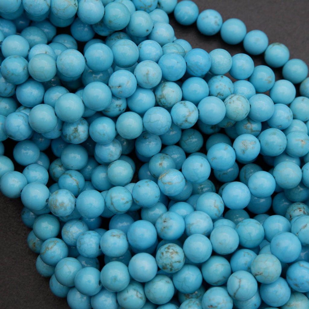 Close-up of blue beads on a dark background