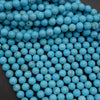 Close-up of blue beads on a dark background