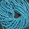 Close-up of blue beads on a dark background