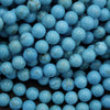 Close-up of blue beads with a dark background
