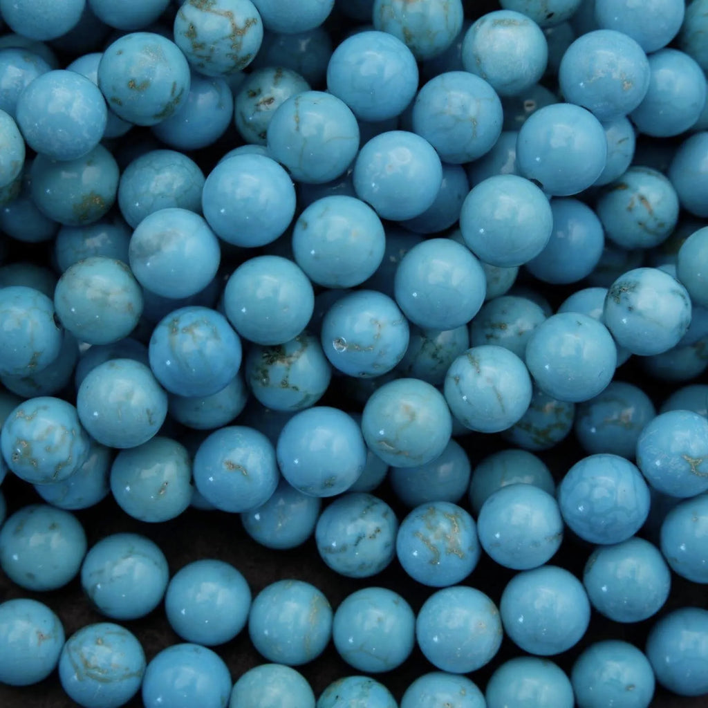 Close-up of blue beads with a dark background