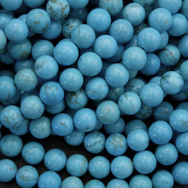 Close-up of blue beads with a dark background