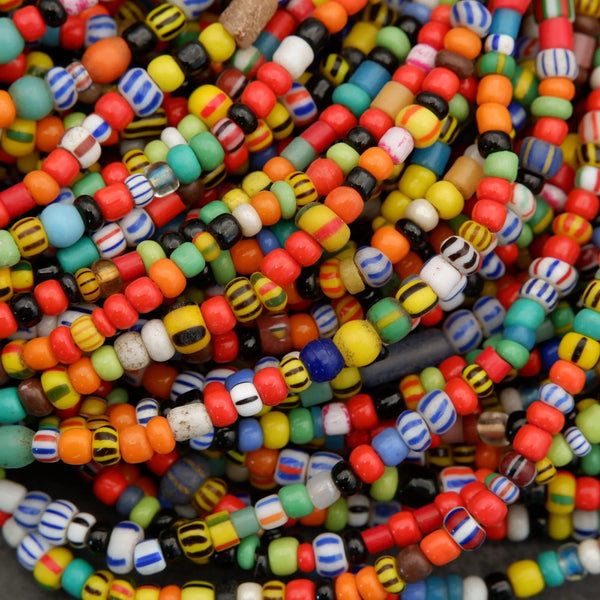 Close-up of colorful glass beads in various shapes and sizes.