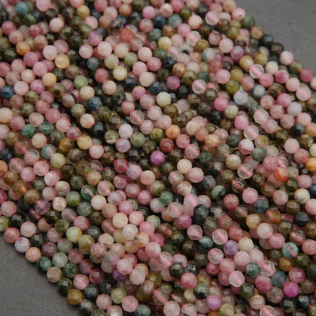 Close-up of multicolored small beads on a gray background