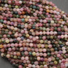 Close-up of multicolored round beads on a gray background
