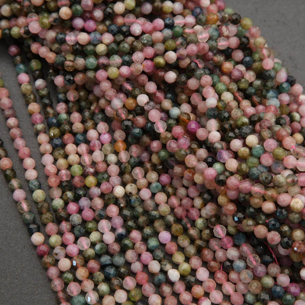 Close-up of multicolored beads on a gray surface