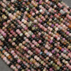 Close-up of multicolored beads on a dark background