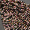 Close-up of multicolored beads on a gray background