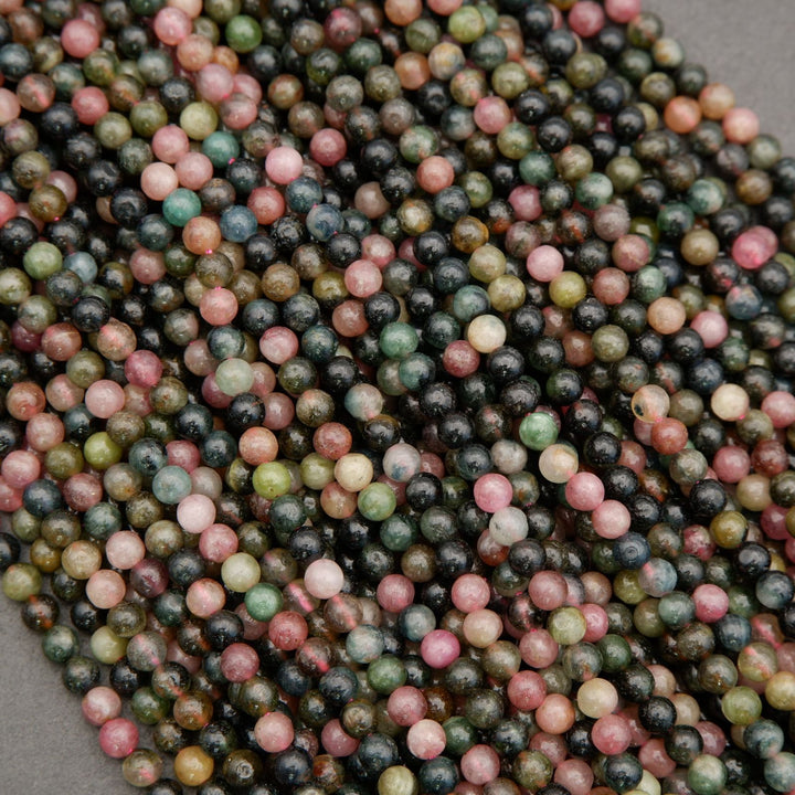 Close-up of multicolored small beads on a gray background