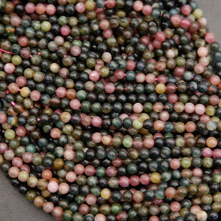 Close-up of multicolored beads on a gray background