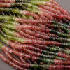 Close-up of multicolored beads on a gray background