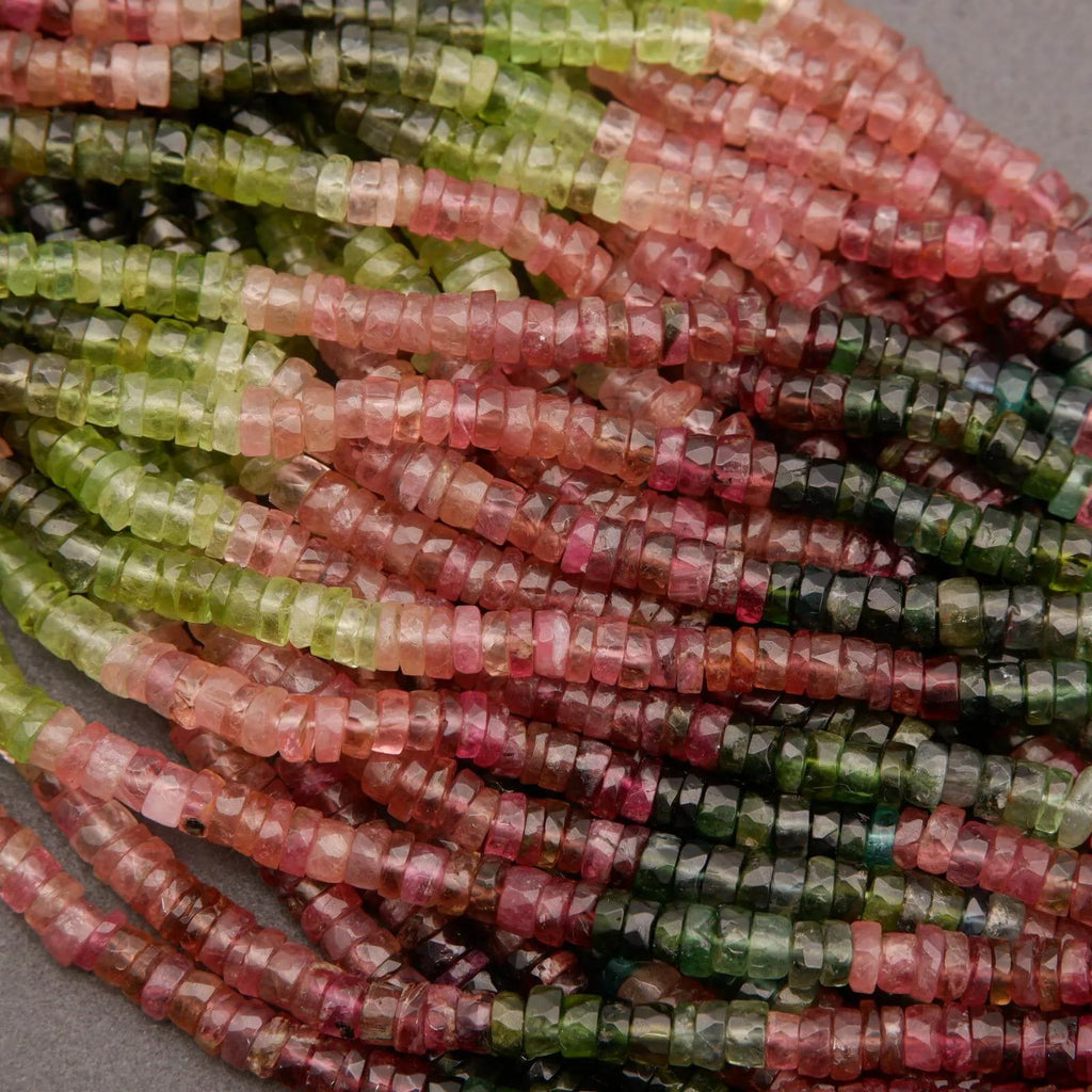 Close-up of multicolored beads on a gray background