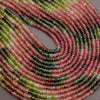 Close-up of multicolored bead string on a gray background