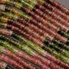 Close-up of multicolored beads on a gray background