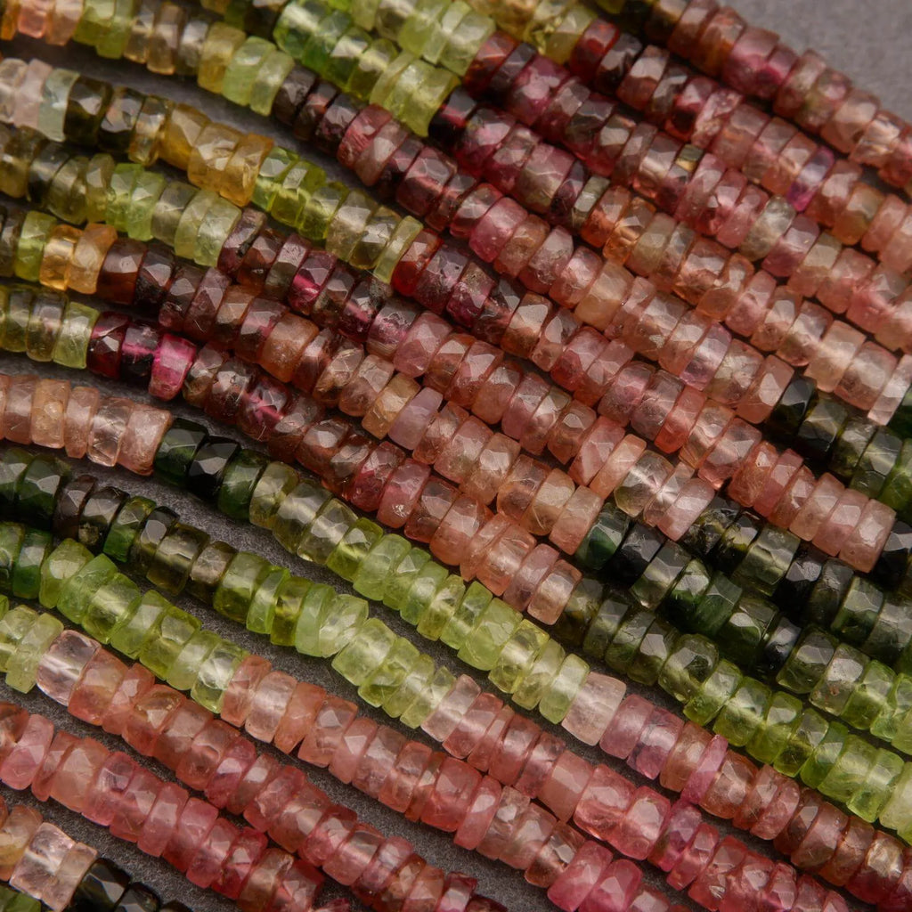 Close-up of multicolored beads on a gray background