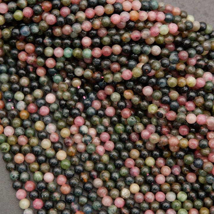 Close-up of multicolored beads on a gray background