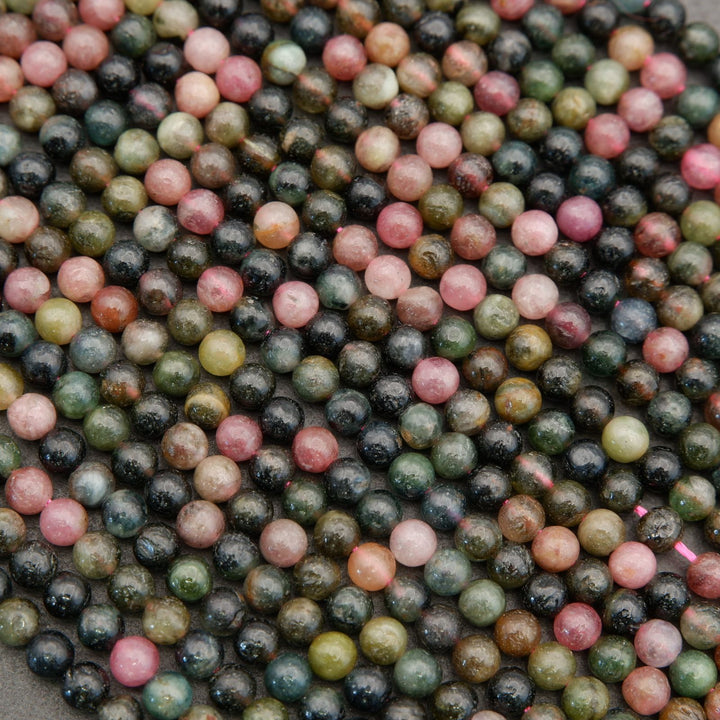 Close-up of multicolored round beads on a dark background