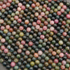 Close-up of multicolored round beads on a dark background