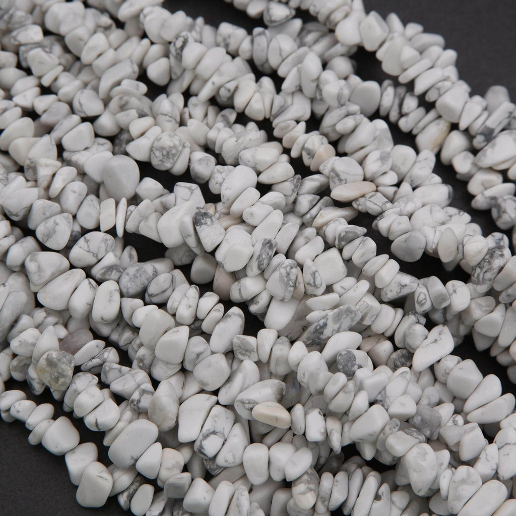 Close-up of small white pebbles on a dark background