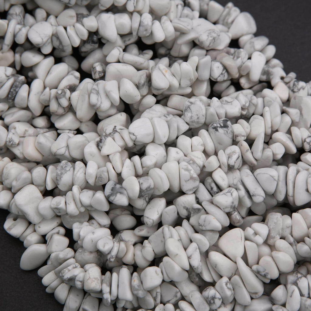Close-up of white pebbles on a dark background