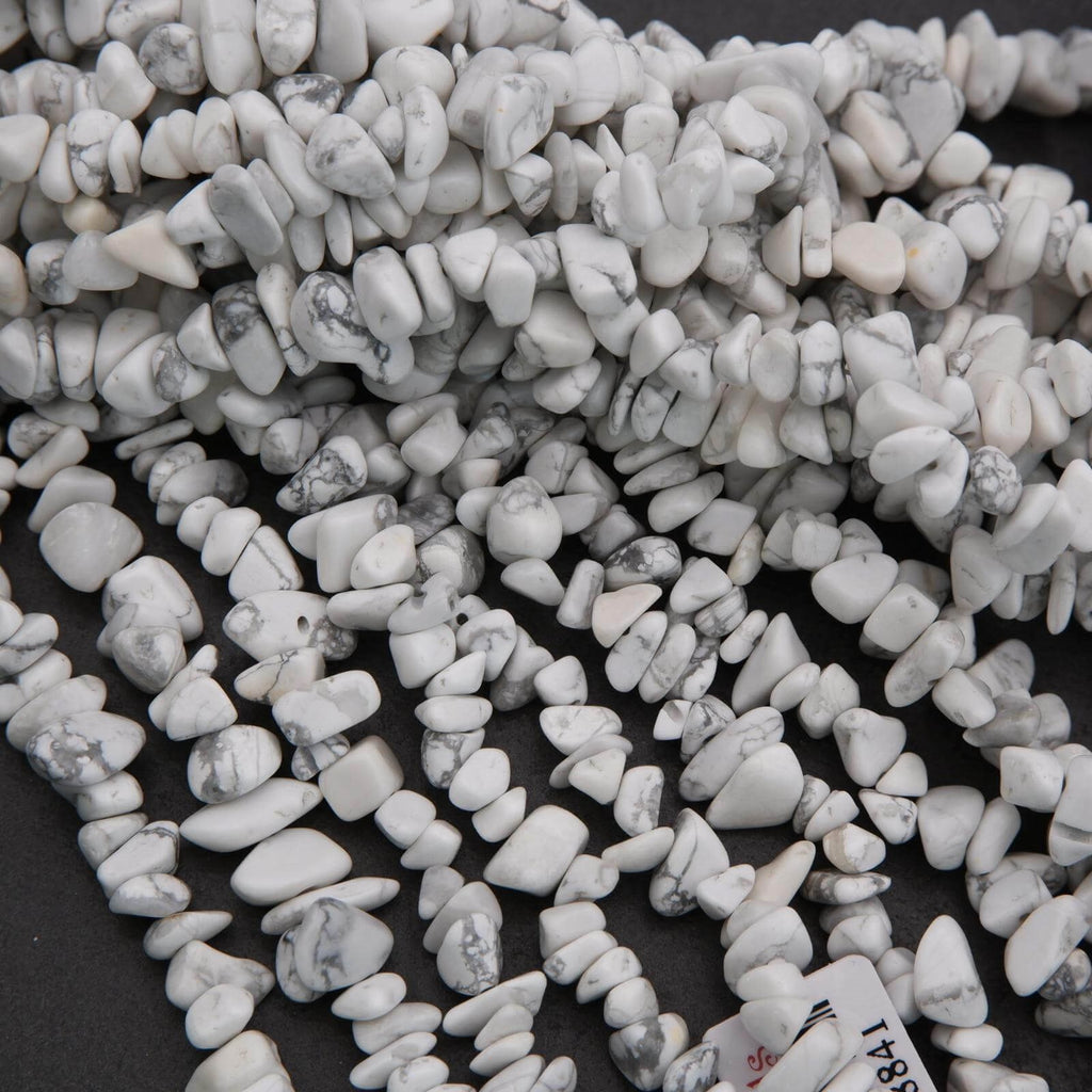 Close-up of small white stones on a dark background