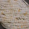 Close-up of clear and yellow beads on a string