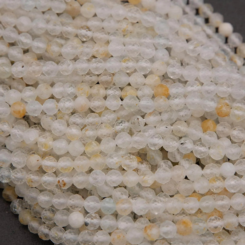 Close-up of clear and yellow beads on a string