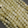 Yellowish green beads with subtle banding.