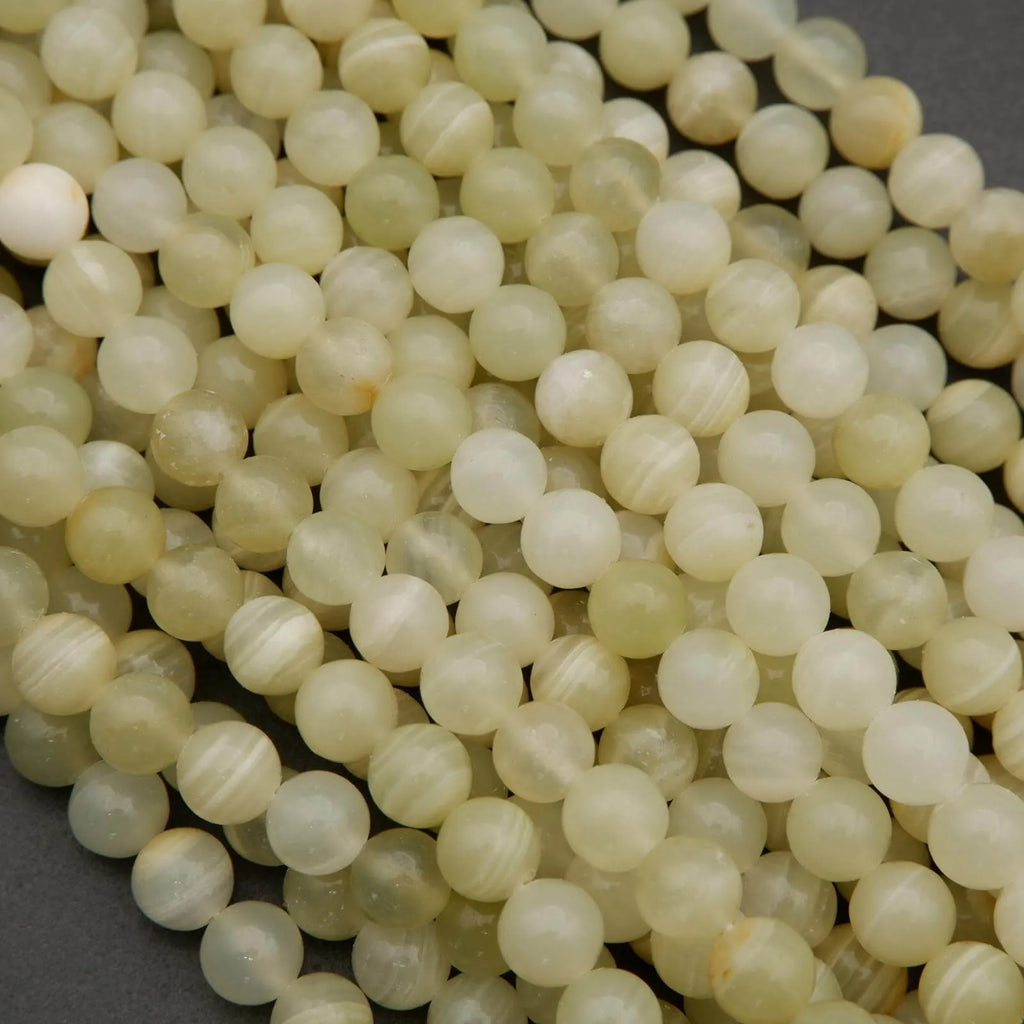 Yellowish green beads with subtle banding.
