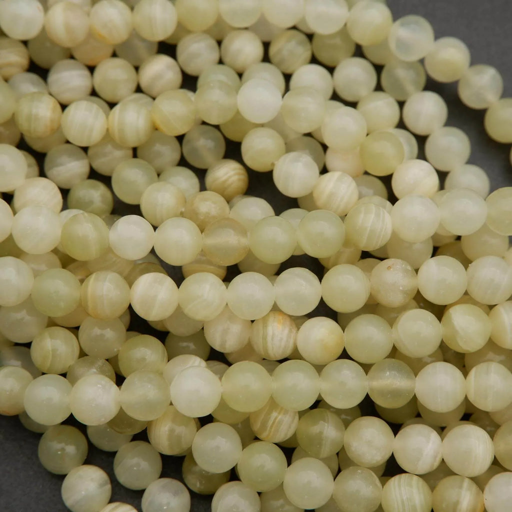 Yellowish green beads with subtle banding.