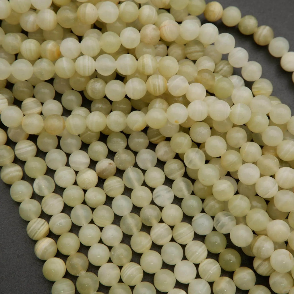 Yellowish green beads with subtle banding.